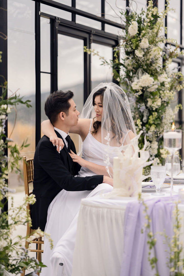 EVERLY bridal veil with delicate lace appliqué detail, fingertip length veil draping over bride's shoulders, outdoor wedding ceremony, Okanagan wedding veil