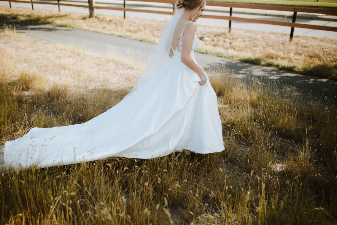 Minimalist cut edge wedding veil with rounded bottom soft tulle drape