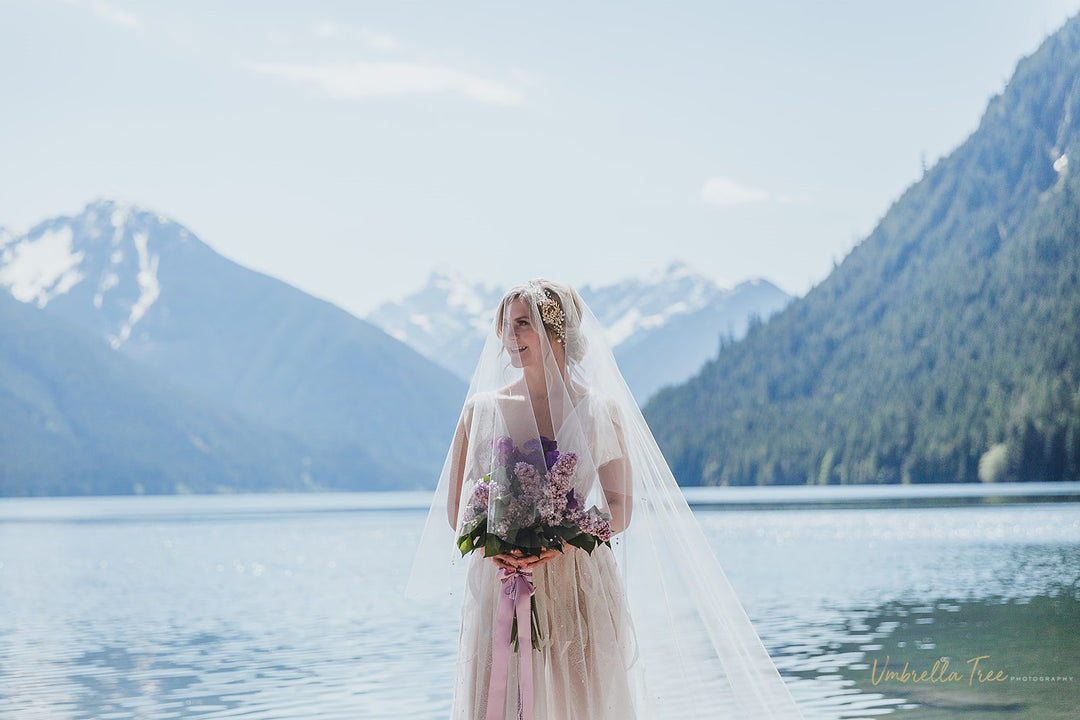 Two tier drop wedding veil with 33 inch blusher and 110 inch cathedral length bottom tier”
