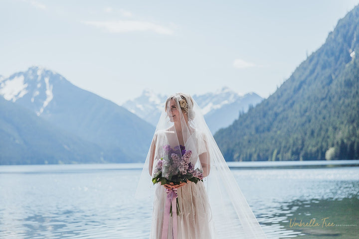 Two tier drop wedding veil with 33 inch blusher and 110 inch cathedral length bottom tier”