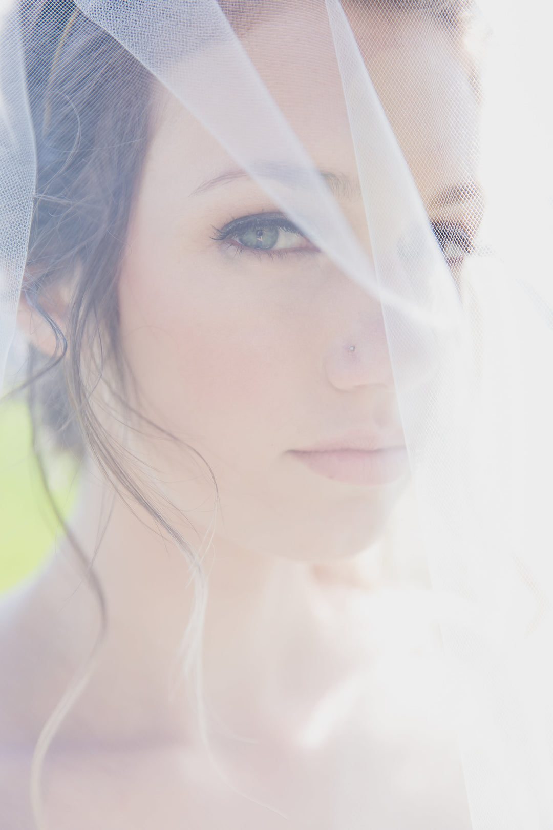 Two tier wedding veil front view with blusher down over face